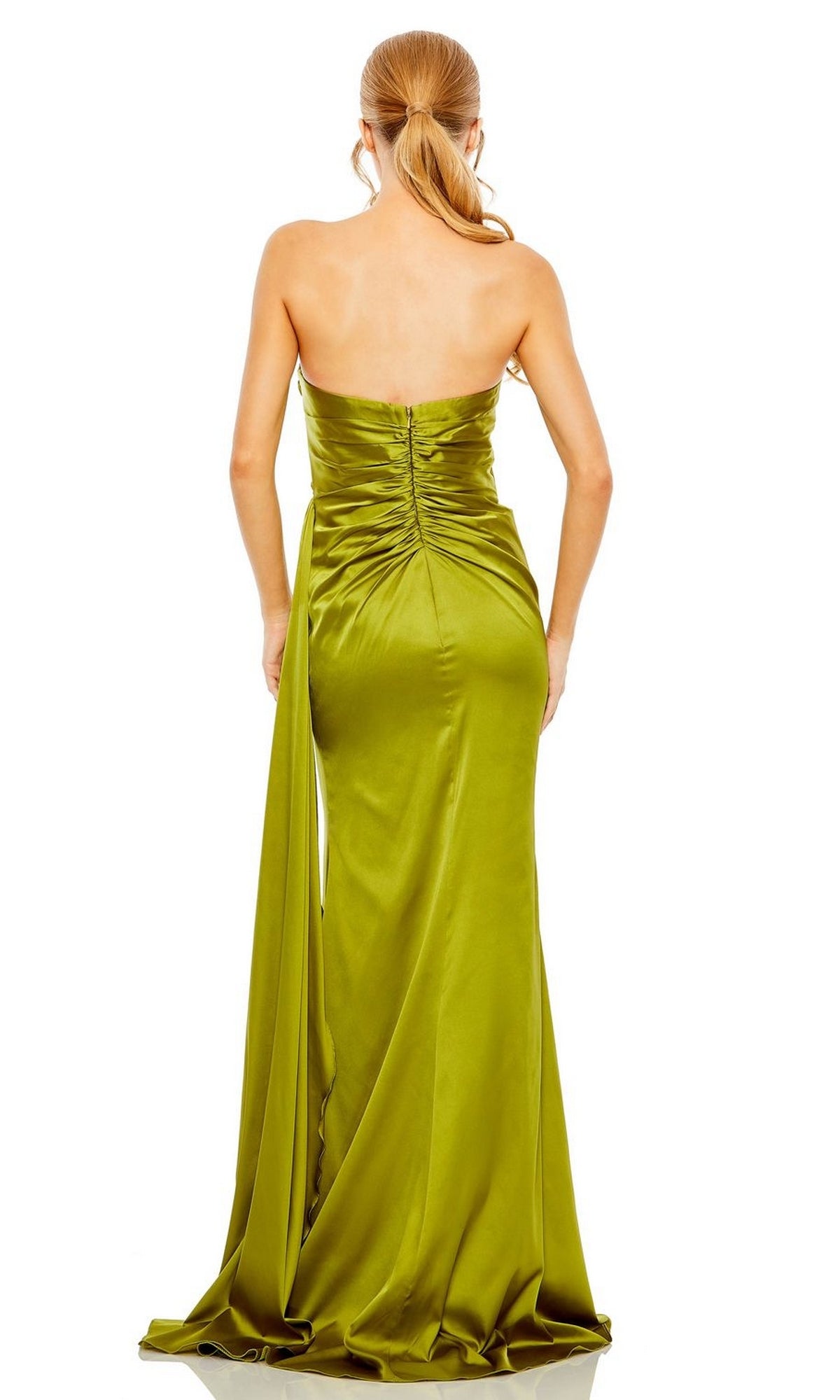 A woman models the Mac Duggal 2211 Side-Drape Strapless Prom Gown—an olive green satin dress with a pleated bodice and draped train—shown from the back against a white background.